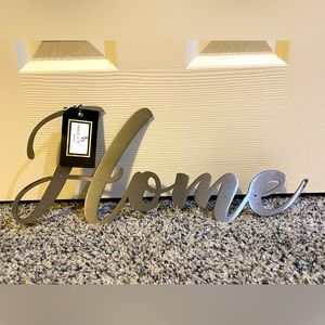 “Home” metal sign